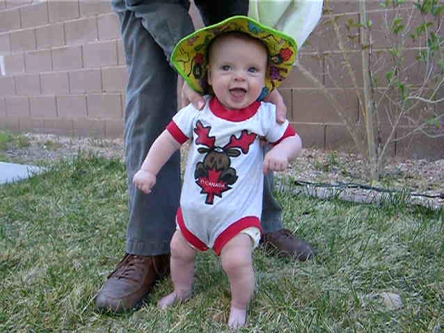 baby walking on grass