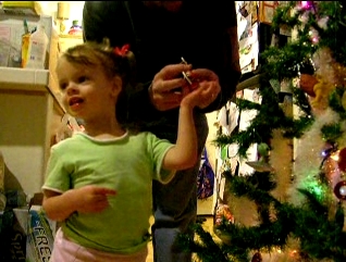 Peo decorating the Christmas Tree.