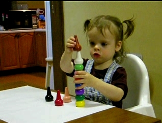 Peo holding pointy crayons.