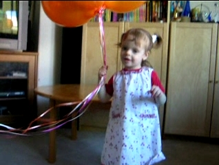 Peo holding balloons.