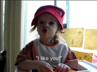 Peo singing in her highchair