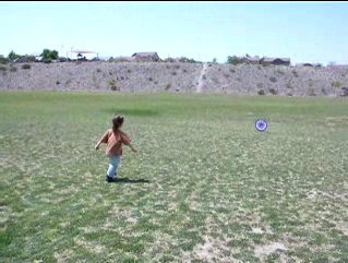 Peo chasing the eyeball frisbee.