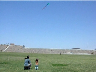 Peo flies a kite.