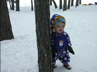 Peo playing in a snowy forest.