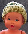 Baby Hat - Green with Yellow Flowers - On Doll - Front