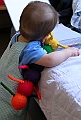 Baby playing with rainbow caterpillar