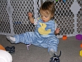 Duck Overalls - Toddler wearing them at home, sitting