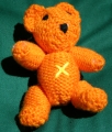 Small Orange Bear with X