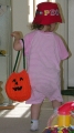 Child Playing with Pumpkin Bag - View 3