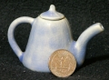Tiny Teapot beside US Quarter