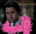 Jack Malone wearing a pink feather boa